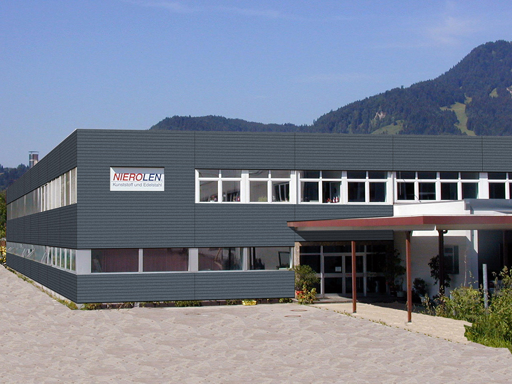 photomontage einer fassade eines betriebsgebäudes in grau